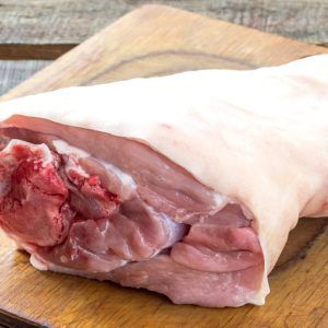 Raw Pork Knuckle On An Old Cutting Board. Rustic Style. Selective Focus