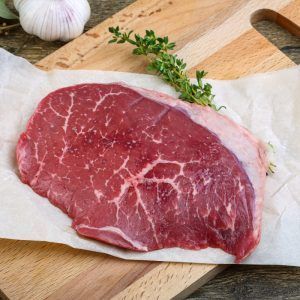 Raw Beef Steak With Thyme Ready For Cooking
