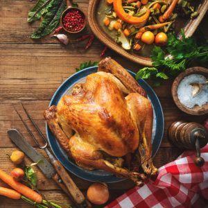 Christmas Or Thanksgiving Turkey On Rustic Wooden Table